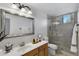 Bathroom featuring white countertops, tile shower, and neutral walls at 721 W Cherrywood Dr, Chandler, AZ 85248