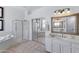 Spacious bathroom with walk-in shower, dual sinks, and soaking tub at 721 W Cherrywood Dr, Chandler, AZ 85248