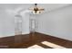 Spacious primary bedroom boasting hardwood floors and archway leading to bathroom at 721 W Cherrywood Dr, Chandler, AZ 85248