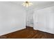 Bright bedroom features hardwood floors, modern ceiling fan, and closet space at 721 W Cherrywood Dr, Chandler, AZ 85248