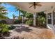 Inviting covered patio with terracotta tile flooring, ceiling fan, and views of the landscaped backyard at 721 W Cherrywood Dr, Chandler, AZ 85248