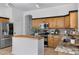Functional kitchen featuring an island with butcher block top, granite counters, and stainless appliances at 721 W Cherrywood Dr, Chandler, AZ 85248