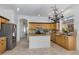 Well-appointed kitchen featuring a center island, granite countertops, and stainless steel appliances at 721 W Cherrywood Dr, Chandler, AZ 85248