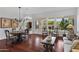 Spacious living and dining area with gleaming hardwood floors and an abundance of natural light at 721 W Cherrywood Dr, Chandler, AZ 85248