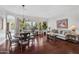 Open-concept living area with hardwood floors, lots of windows, and a combined living and dining space at 721 W Cherrywood Dr, Chandler, AZ 85248