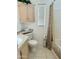 Cozy bathroom featuring a vanity with a countertop, toilet, and shower with patterned curtain at 7750 E Broadway Rd # 814, Mesa, AZ 85208