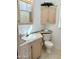 Cozy bathroom featuring a vanity with a countertop, toilet, and shower with patterned curtain at 7750 E Broadway Rd # 814, Mesa, AZ 85208