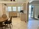 An open kitchen area with a dining table and tiled floor, perfect for Gathering meals at 7750 E Broadway Rd # 814, Mesa, AZ 85208