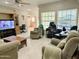 A cozy living room featuring multiple seating options and natural light at 7750 E Broadway Rd # 814, Mesa, AZ 85208