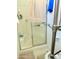 Bathroom shower with a frosted glass door and a built-in seat at 7750 E Broadway Rd # 814, Mesa, AZ 85208