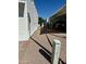 View of the side yard with gravel, carport, and shade; showing the property's outdoor space and parking at 7750 E Broadway Rd # 814, Mesa, AZ 85208