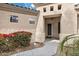 Inviting front entryway featuring desert landscaping, a covered porch, and security door at 890 W Oriole Way, Chandler, AZ 85286