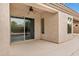 Covered patio area with ceiling fan, sliding door access, and ample space for entertaining guests at 890 W Oriole Way, Chandler, AZ 85286