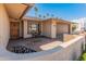 Inviting front porch with decorative wall, exterior seating and stylish front door at 9945 W Cameo Dr, Sun City, AZ 85351