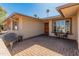 Cozy front porch with seating and manicured landscaping in a well-kept neighborhood at 9945 W Cameo Dr, Sun City, AZ 85351