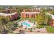 Aerial view of the community showcasing well-maintained landscaping, resort-style pool area, and uniquely designed buildings at 12222 N Paradise Village S Pkwy # 224, Phoenix, AZ 85032
