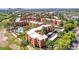 Expansive aerial view highlighting the community layout, green spaces, and a glimpse of the pool and recreational areas at 12222 N Paradise Village S Pkwy # 224, Phoenix, AZ 85032