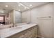 Bathroom featuring a double sink vanity with marble countertop and ample storage space at 12222 N Paradise Village S Pkwy # 224, Phoenix, AZ 85032