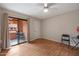 Bright bedroom with a sliding glass door to a balcony and light wood flooring at 12222 N Paradise Village S Pkwy # 224, Phoenix, AZ 85032