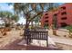 Serene common area with mature trees providing shade over benches, creating a tranquil outdoor space at 12222 N Paradise Village S Pkwy # 224, Phoenix, AZ 85032