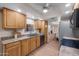 Beautiful kitchen with wood cabinets and a view into the dining area, perfect for cooking and entertaining at 12222 N Paradise Village S Pkwy # 224, Phoenix, AZ 85032