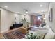 Cozy living room with neutral walls, a large window letting in natural light, stylish decor, and a comfortable sofa at 12222 N Paradise Village S Pkwy # 224, Phoenix, AZ 85032