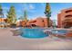 Resort-style pool with waterfall feature, clear blue water, and plenty of space for recreation at 12222 N Paradise Village S Pkwy # 224, Phoenix, AZ 85032
