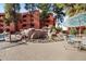 Serene poolside setting with a tranquil waterfall, comfortable seating, and lush surrounding greenery at 12222 N Paradise Village S Pkwy # 224, Phoenix, AZ 85032