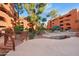 Tranquil community pool area featuring lush landscaping and comfortable seating for relaxing outdoors at 12222 N Paradise Village S Pkwy # 224, Phoenix, AZ 85032