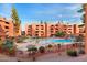 Picturesque pool area with waterfall, community seating, and manicured landscaping for a relaxing experience at 12222 N Paradise Village S Pkwy # 224, Phoenix, AZ 85032