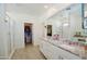 Modern bathroom with double sinks, granite countertops, and a glass-enclosed shower with walk in closet at 12330 E Crystal Frst, Gold Canyon, AZ 85118