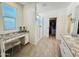 Bright bathroom with a granite countertop vanity, walk-in shower, and a walk-in closet space at 12330 E Crystal Frst, Gold Canyon, AZ 85118