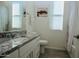 Bright bathroom with granite countertop, white cabinets, and a bathtub with shower combination at 12330 E Crystal Frst, Gold Canyon, AZ 85118