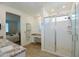 Bright bathroom featuring a frameless glass shower, granite counters, and a view to the bedroom at 12330 E Crystal Frst, Gold Canyon, AZ 85118