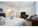 Inviting bedroom with neutral decor, a comfortable bed, and natural light from the window at 12330 E Crystal Frst, Gold Canyon, AZ 85118