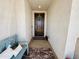 Welcoming front entrance featuring a dark wooden door with a wreath and a cozy bench at 12330 E Crystal Frst, Gold Canyon, AZ 85118