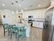 Bright kitchen with white cabinets, granite countertops, stainless steel appliances, and a center island at 12330 E Crystal Frst, Gold Canyon, AZ 85118