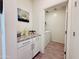 Well-organized laundry room with storage cabinets, a decorative countertop, and a modern washing machine at 12330 E Crystal Frst, Gold Canyon, AZ 85118