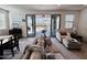 Cozy living room with natural light, neutral-toned furniture, and sliding glass doors to the backyard at 12330 E Crystal Frst, Gold Canyon, AZ 85118
