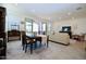 Bright living area featuring a dining table and comfortable seating with access to the outdoors at 12330 E Crystal Frst, Gold Canyon, AZ 85118