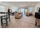 Spacious living room with tile floors, plush seating, and sliding glass doors to the outdoor space at 12330 E Crystal Frst, Gold Canyon, AZ 85118