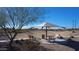 Neighborhood park featuring covered picnic tables, benches and a walking path at 12330 E Crystal Frst, Gold Canyon, AZ 85118