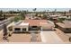 An aerial view of a single-story home with solar panels and desert landscaping at 12423 W Morning Dove Dr, Sun City West, AZ 85375