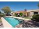 Beautiful backyard with pool, patio, and well-maintained landscaping perfect for outdoor entertaining at 12423 W Morning Dove Dr, Sun City West, AZ 85375