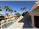 Spacious balcony overlooking a pool and lush palm trees at 1302 E Tierra Buena Ln, Phoenix, AZ 85022