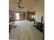 Well-lit bonus room featuring neutral carpet, windows, and ceiling fan at 1302 E Tierra Buena Ln, Phoenix, AZ 85022