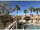 Community view from balcony, featuring mature trees and neighborhood streets at 1302 E Tierra Buena Ln, Phoenix, AZ 85022