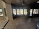 Spacious living room featuring tile flooring, a ceiling fan, and large windows for natural light at 1302 E Tierra Buena Ln, Phoenix, AZ 85022