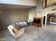 Bright living room with tile flooring, a comfortable sofa, chair, and a classic entertainment center at 1302 E Tierra Buena Ln, Phoenix, AZ 85022