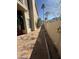 An exterior walkway featuring pavers, plants and partial building view at 1302 E Tierra Buena Ln, Phoenix, AZ 85022